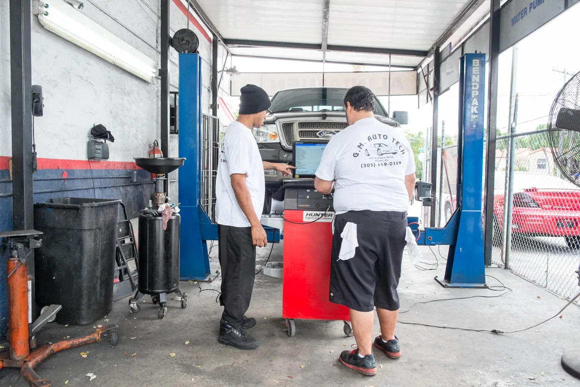 Technician working in the GM Auto Tech bay